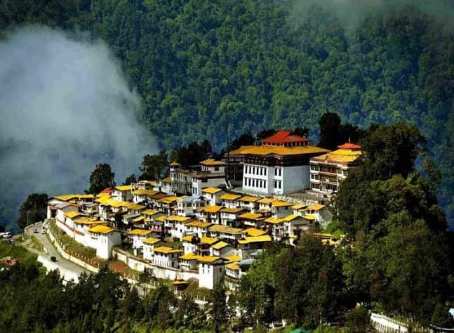 The iconic 400-year-old Tawang Monastery amidst snow-capped peaks in Tawang Valley, Arunachal Pradesh